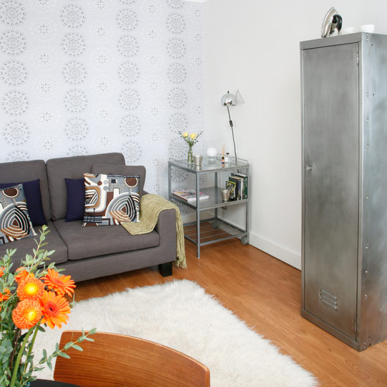 Dinning table with chairs and white walls with wooden flooring