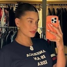 Hailey Bieber taking a selfie in a Kamala Harris graphic tee August 2024