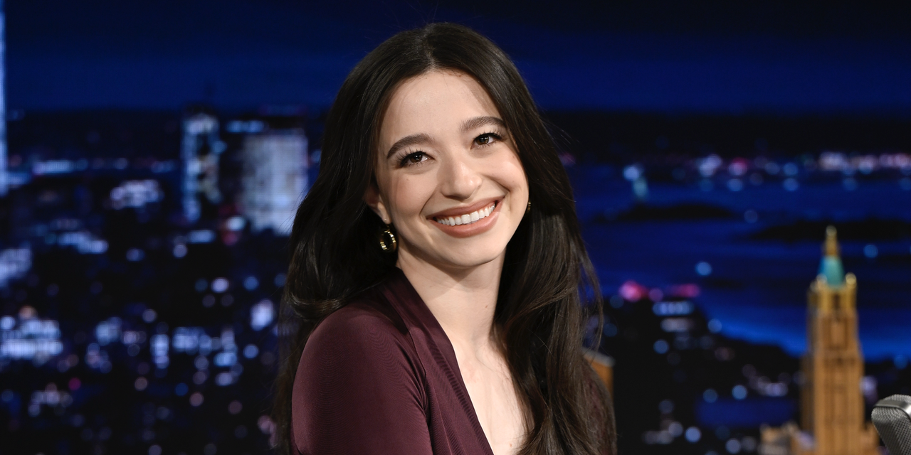 Actress Mikey Madison arrives on Wednesday, January 8, 2025 to the The Tonight Show Starring Jimmy Fallon wearing a plum dress and feathered heels