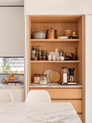 kitchen cupboard with pocket doors