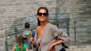 Katie Holmes shows major cleavage while hailing cab with Suri Cruise in NYC