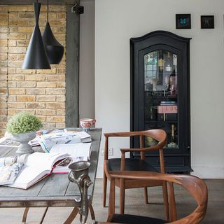 kitchen extension with black storage with table and chair