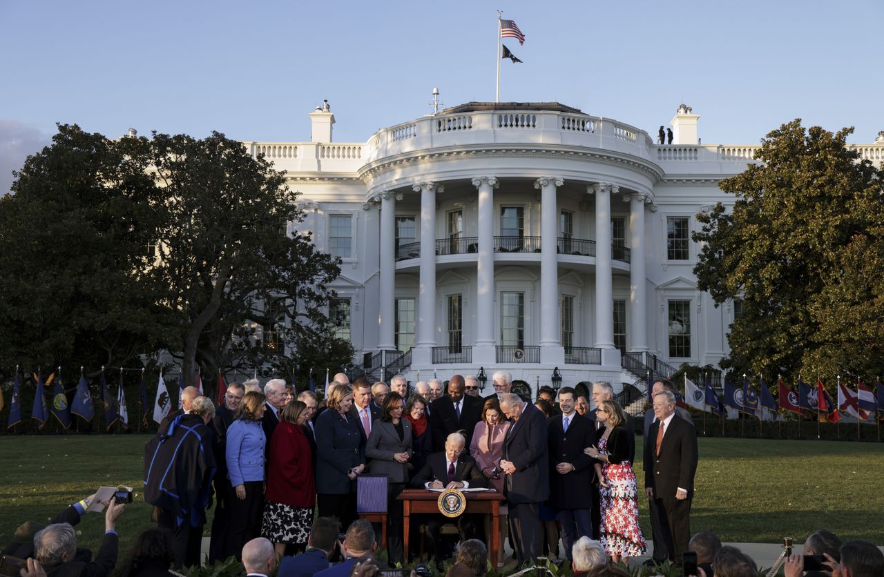 President Joe Biden signs the Infrastructure Investment and Jobs Act