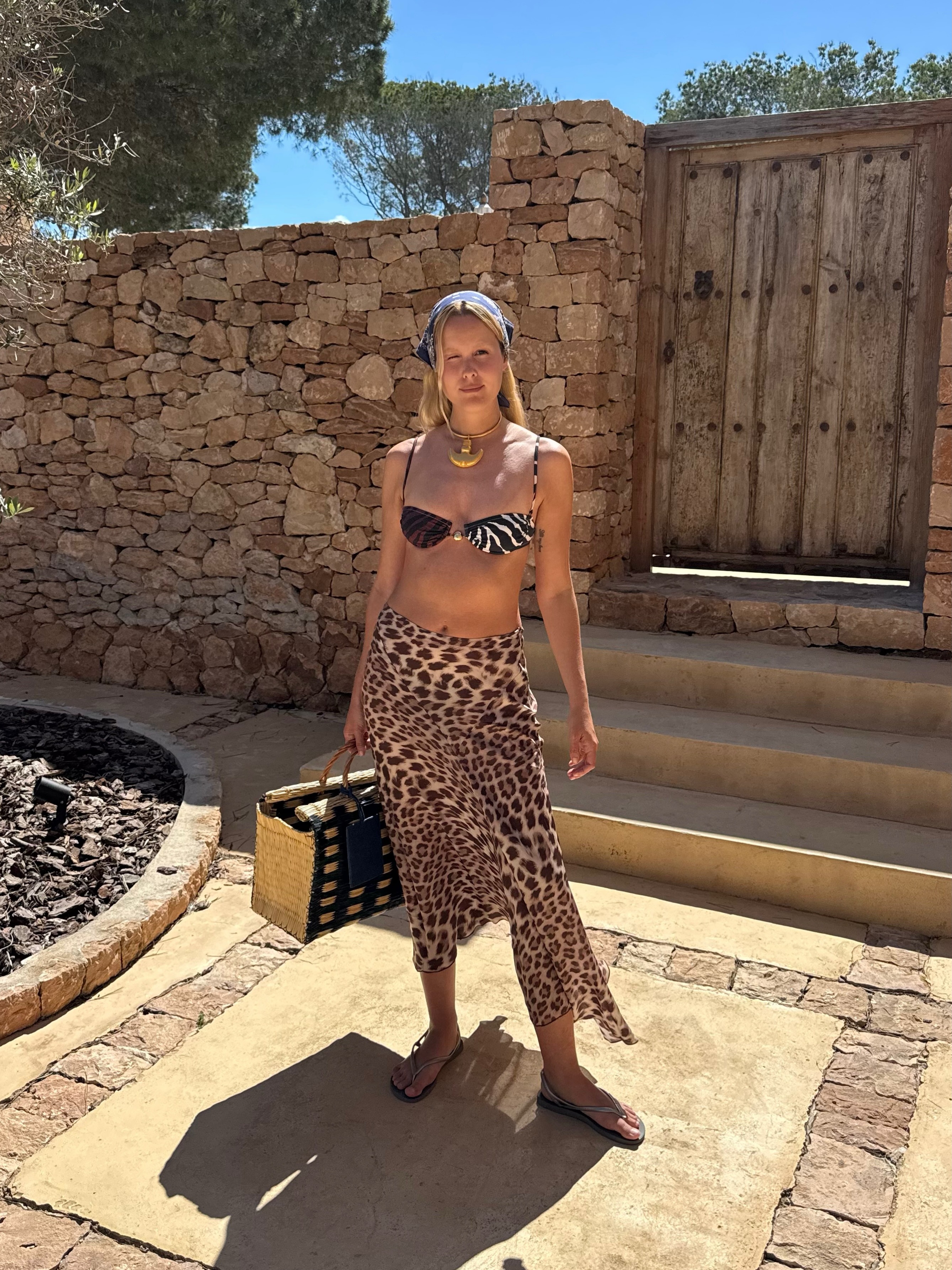 Spanish woman wearing mixed animal prints, a summer 2026 trend.