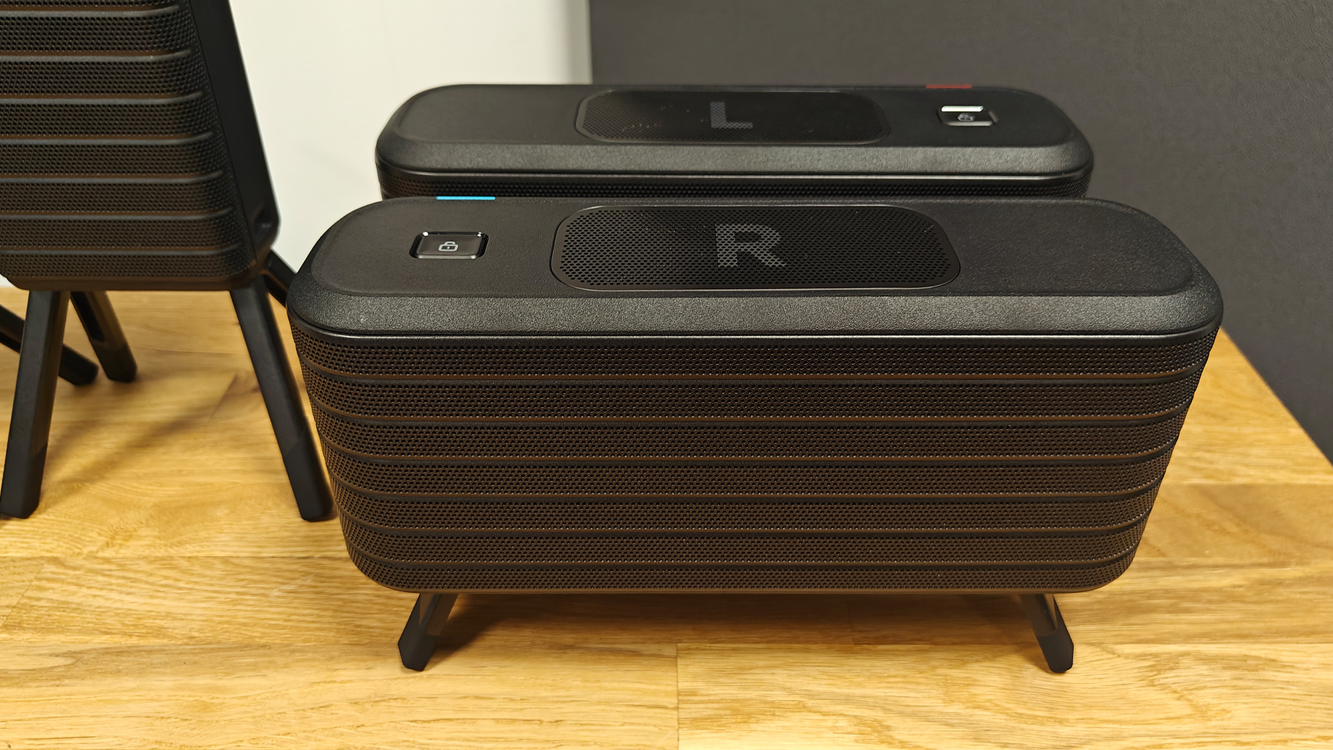 Soundcore Nebula X1 Pro home cinema projector left and right speakers on wooden surface