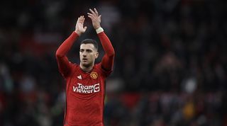 Diogo Dalot of Manchester United celebrates at full time during the Premier League match between Manchester United and West Ham United at Old Trafford on February 4, 2024 in Manchester, England.