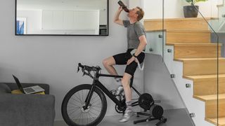 Cycle training on a turbo trainer of static bike at the gym
