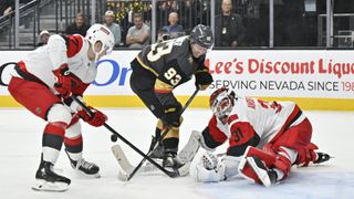 Frederik Andersen of the Carolina Hurricanes making a save against Mitch Marner of the Vegas Golden Knights