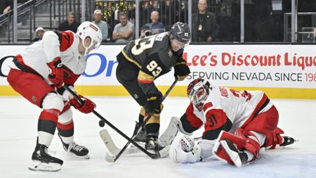 Frederik Andersen of the Carolina Hurricanes making a save against Mitch Marner of the Vegas Golden Knights