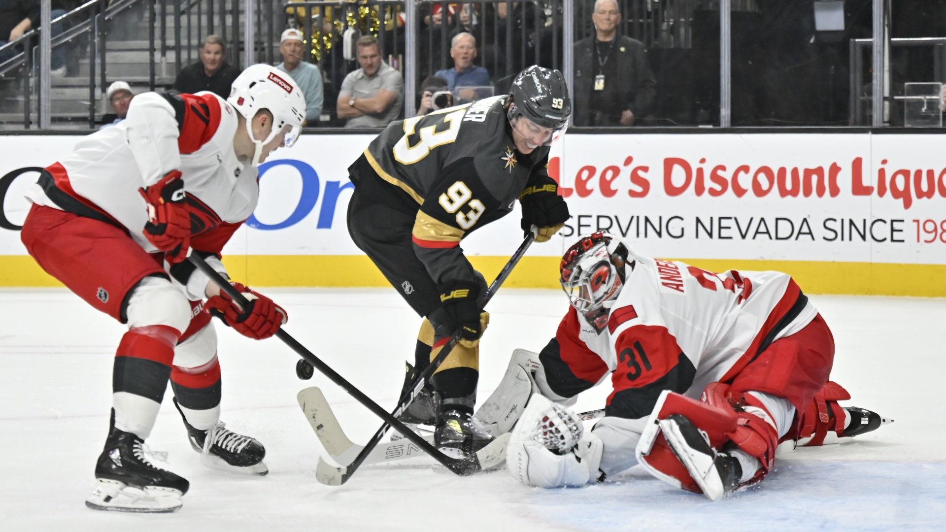 Frederik Andersen of the Carolina Hurricanes making a save against Mitch Marner of the Vegas Golden Knights