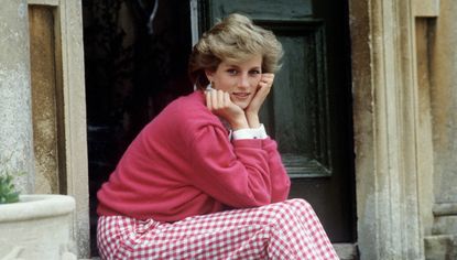 Diana, Princess of Wales (1961 - 1997) sitting on a step at her home, Highgrove House, in Doughton, Gloucestershire, 18th July 1986. 