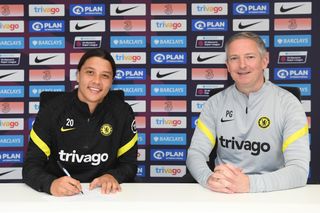 Sam Kerr signed her new deal alongside assistant manager Paul Green (Chelsea handout/PA)