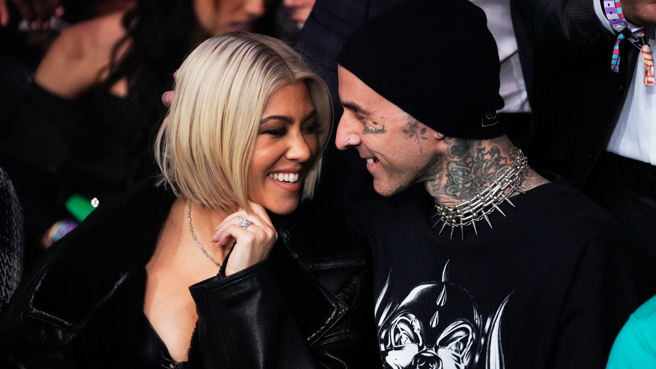 Kourtney Kardashian Barker and Travis Barker stare lovingly at one another