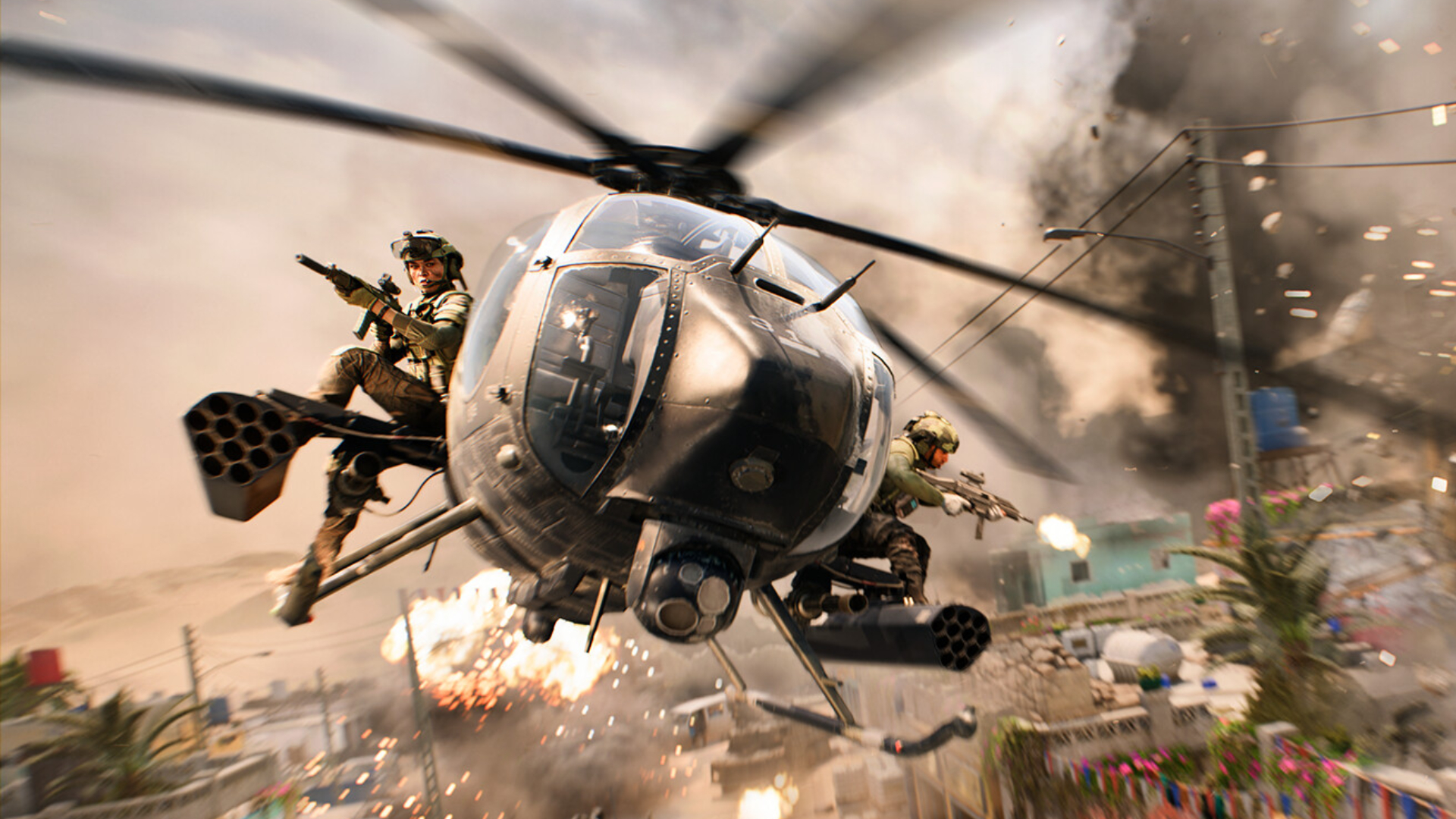 Soldiers fire their weapons while riding aboard a Little Bird scout helicopter in Battlefield 2042.