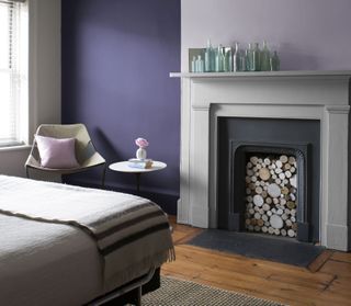 a two colour fireplace with dark purple alcoves