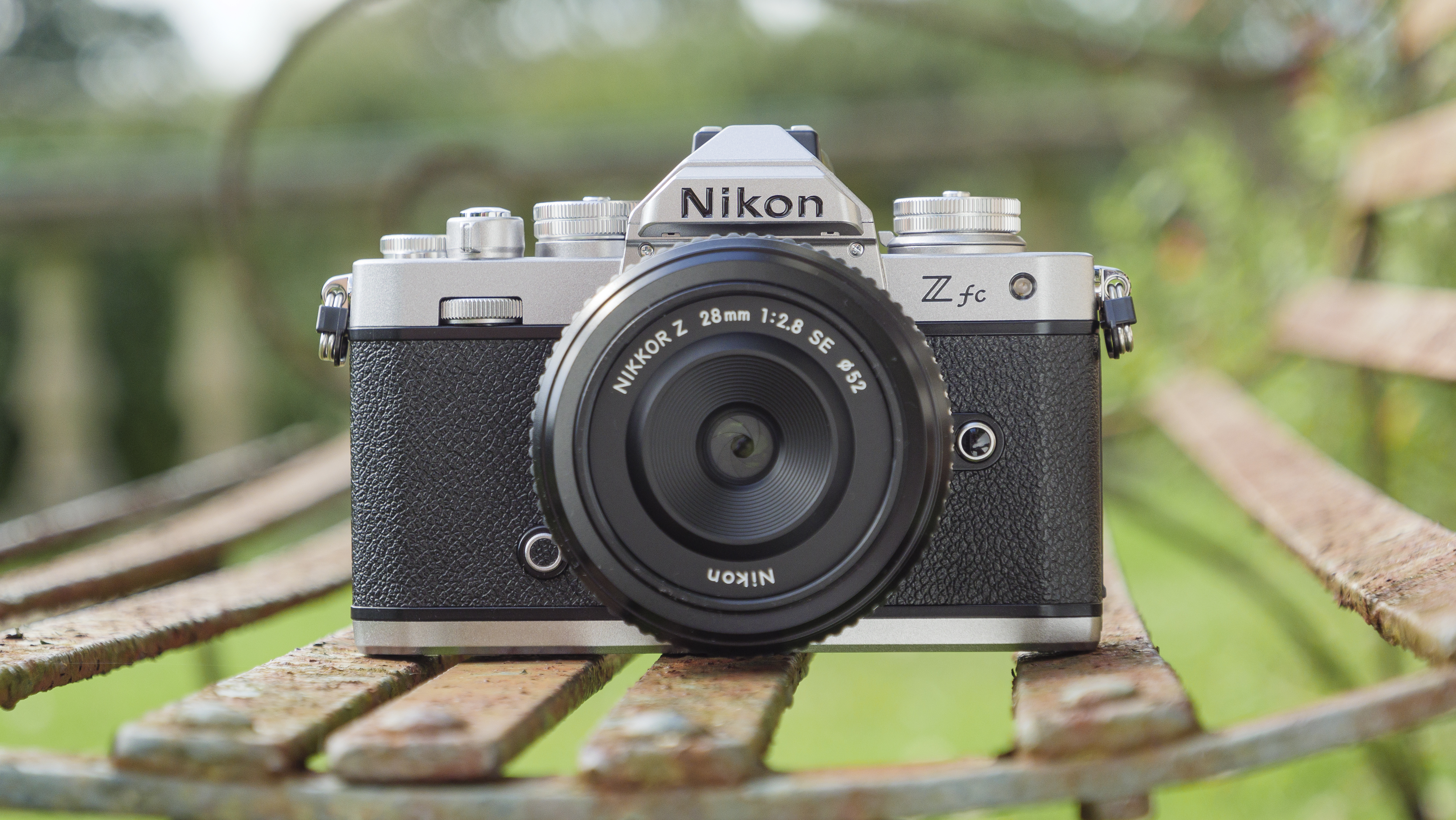 The Nikon Z fc camera on a park bench