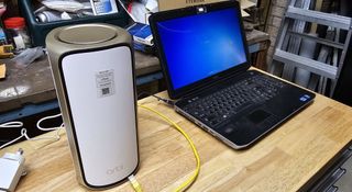 A Netgear Orbi 970 being set up with a laptop