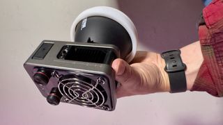 Zhiyun Molus X60 video light held in a hand