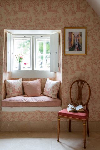 window-seat-with-floral-wallpaper-and-shuttered-window