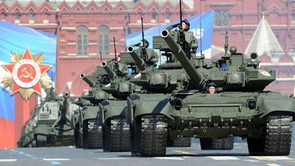 A column of Russian T-90 tanks rolls through Red Square