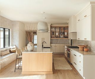 kitchen with wooden floor and cabinetry painted in grey colors