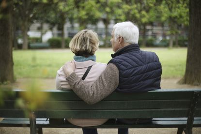 Couple sitting on a park bench