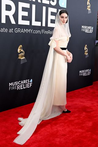 Gracie Abrams wearing Chanel gown and Chanel jewels on 2025 Grammys Red Carpet