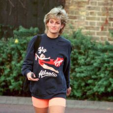 Princess Diana wearing a Virgin Atlantic sweatshirt and bike shorts