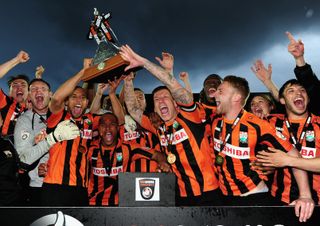 Barnet players celebrate after winning the Conference in April 2015.