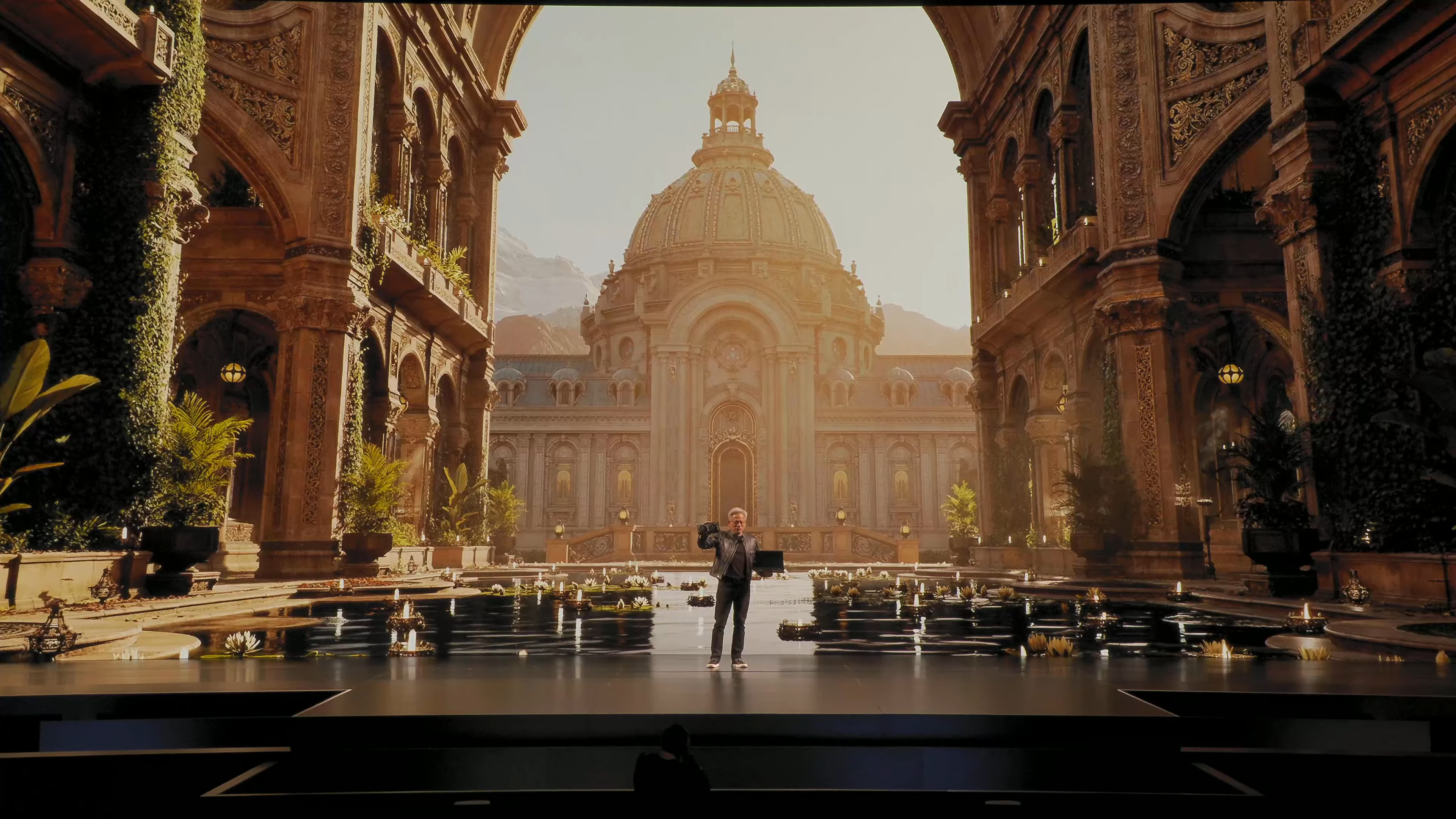 Jensen Huang holding aloft a Nvidia GeForce RTX 5060 graphics card alongside a similarly powered MSI laptop at Nvidia's Computex 2025 keynote.