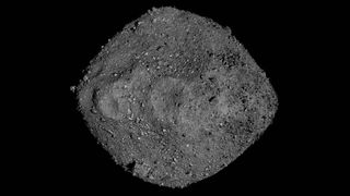 photo of a pyramid-shaped asteroid in deep space.
