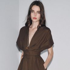 Woman wears brown dress with ruched waist
