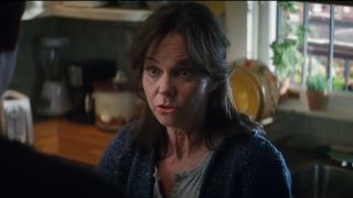 Sally Field stands in mid conversation in the kitchen in The Amazing Spider-Man 2.