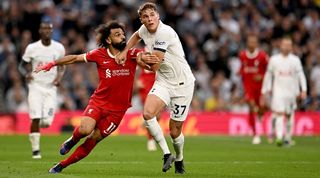 Micky van de Ven holds off Mohamed Salah during Tottenham's 2-1 win over Liverpool in the Premier League in September 2023.