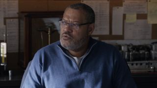 Laurence Fishburne looking to his left in Ant-Man and the Wasp. 