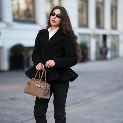 street style shot of woman wearing peplum jacket