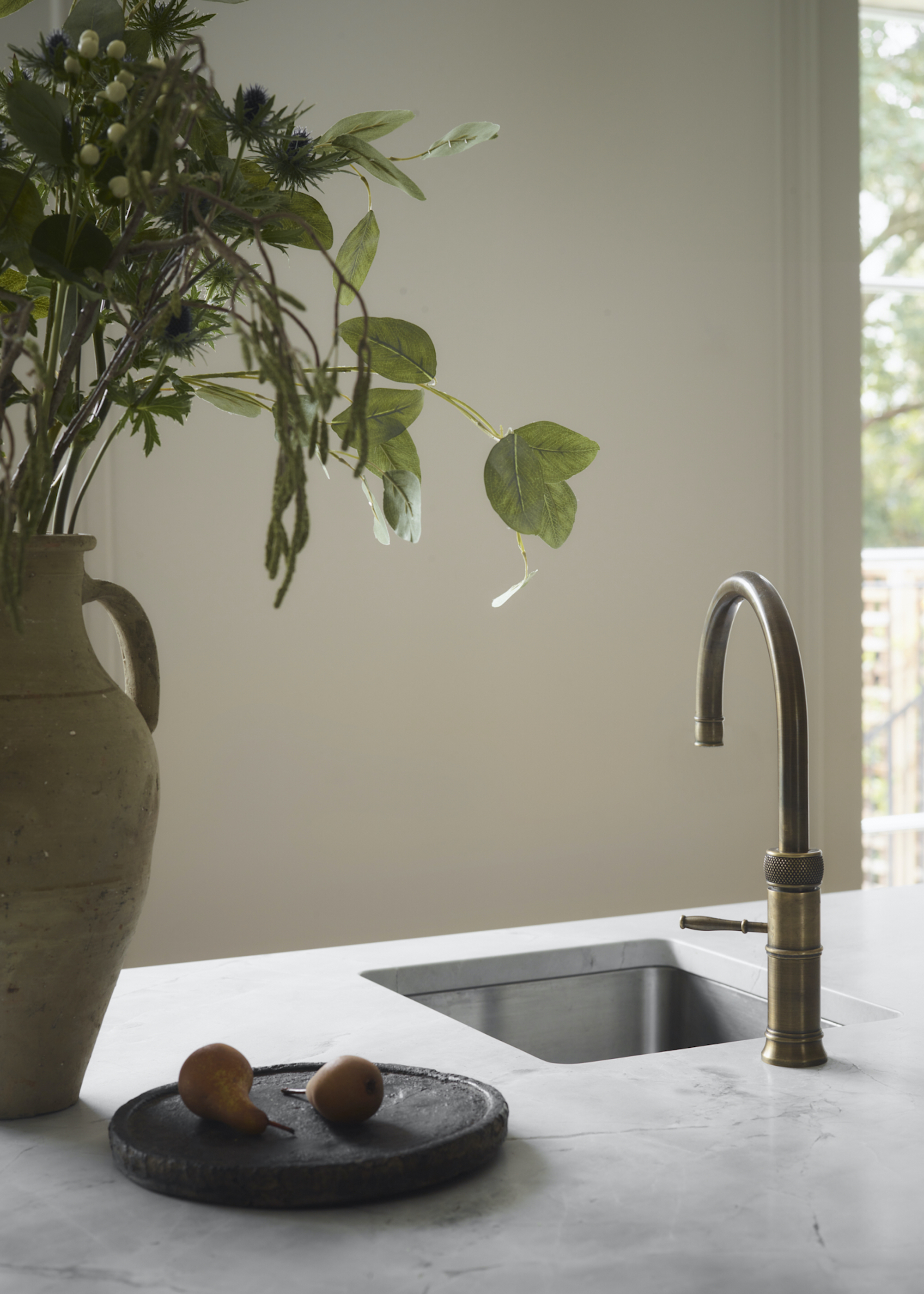 close up of tap on marble island