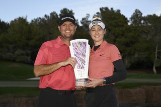 Caddie Jason McDede and Nelly Korda of the United States pose with the trophy on day five of the T-Mobile Match Play presented by MGM Rewards at Shadow Creek at Shadow Creek Golf Course on April 07, 2024