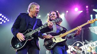 Guitarist Alex Lifeson, bassist Geddy Lee, and drummer Neil Peart of Rush performs at Bridgestone Arena on May 1, 2013 in Nashville, Tennessee. 