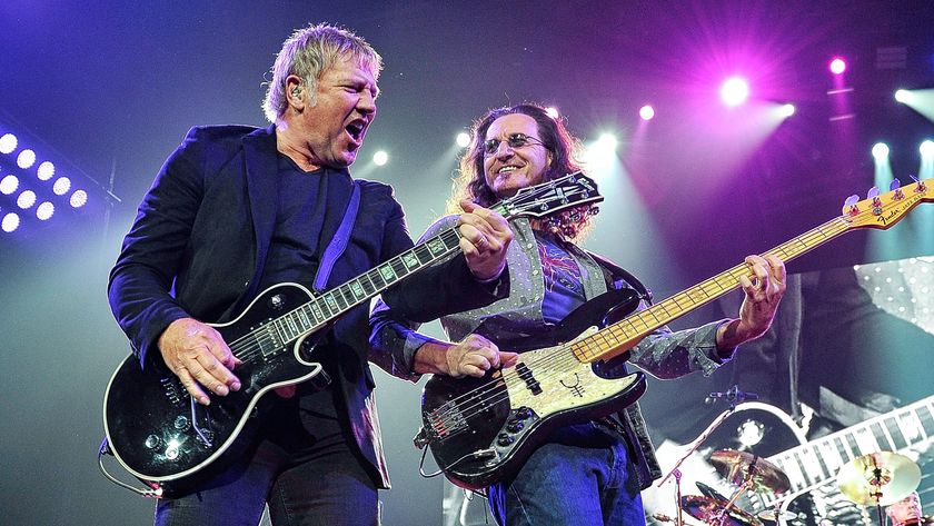 Guitarist Alex Lifeson, bassist Geddy Lee, and drummer Neil Peart of Rush performs at Bridgestone Arena on May 1, 2013 in Nashville, Tennessee. 