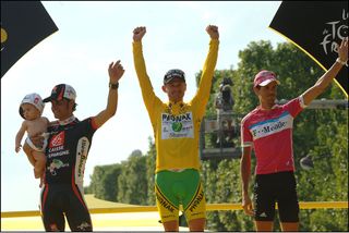 Floyd Landis (centre) celebrates winning the 2006 Tour de France – but the victory was later awarded to Oscar Pereiro (left) after Landis failed a drugs test (Watson)