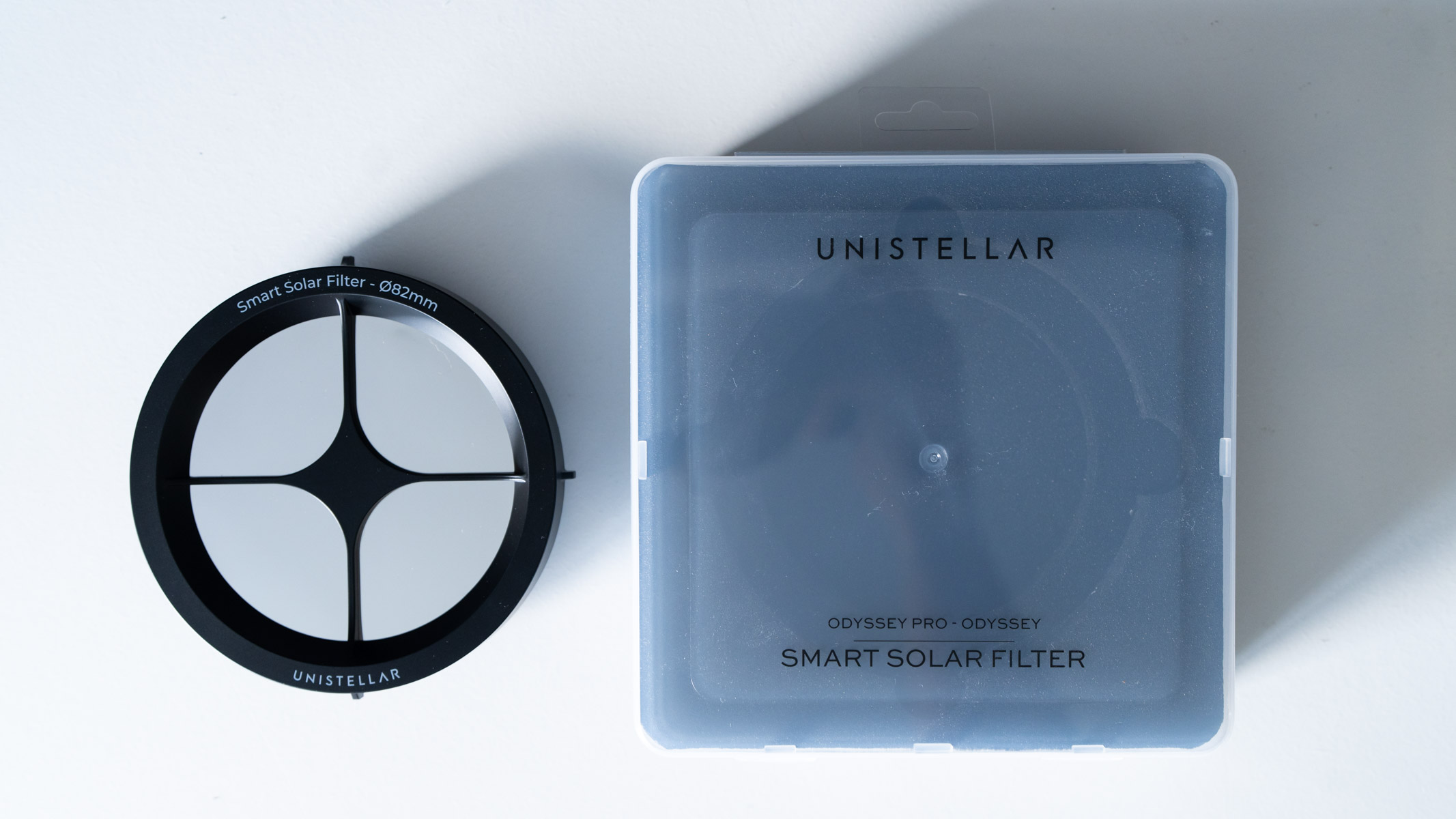 Unistellar Odyssey Pro smart telescope solar filter on a white table