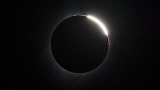 Some prominences are seen as the moon begins to move off the sun during the total solar eclipse on Monday, August 21, 2017 above Madras, Oregon.