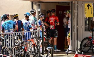 Riders wait to take their mandatory Covid19 tests after competing in the 15th stage of the 109th edition of the Tour de France cycling race 2025 km between Rodez and Carcassonne in southern France on July 17 2022 Photo by Marco BERTORELLO AFP Photo by MARCO BERTORELLOAFP via Getty Images