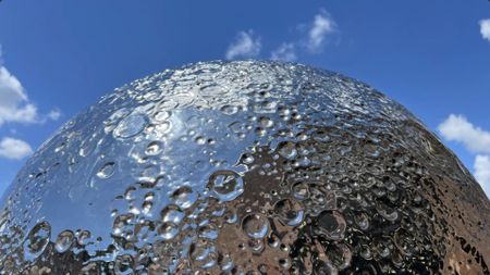 an image of the top half of the spherical moon sculpture