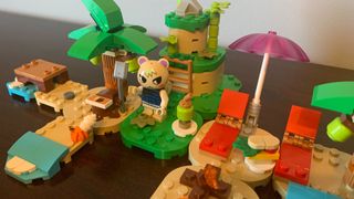Lego Kapp'n's Island Boat Tour set laid out on a wooden table, from a high angle