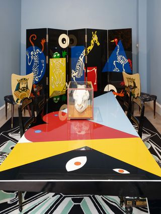 'Visite médicale au zoo' screen, by Vincent Darré; pair of Italian chairs, upholstered in fabric by Vincent Darré, for Pierre Frey; bone sculpture; 'Figure' table, by Vincent Darré; and 'Perspective' carpet, by Vincent Darré