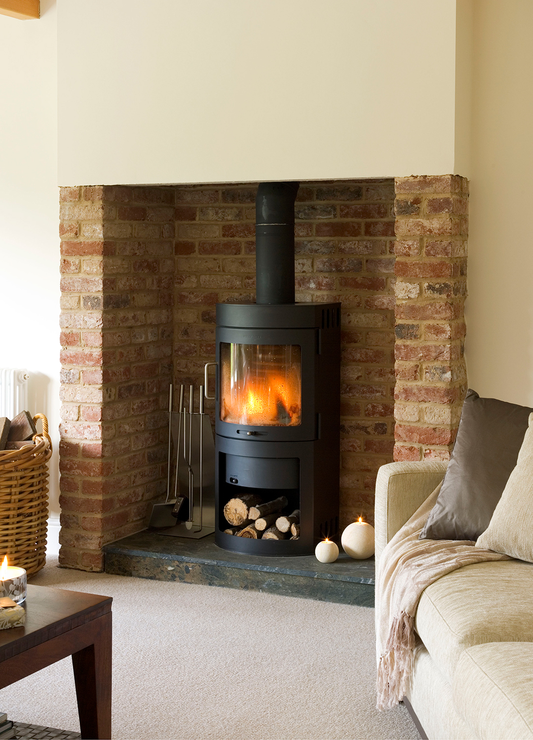 Cream living room fireplace with a wood burning stove