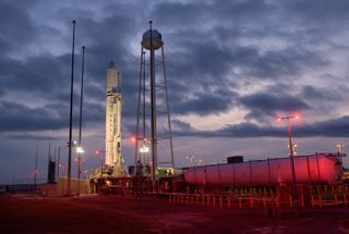 The Antares rocket that will launch the next cargo shipment to the International Space Station this weekend is pictured shortly after its arrival at the launch pad on Tuesday (Oct. 29). Topped with a Cygnus cargo spacecraft, the rocket will lift off from NASA's Wallops Flight Facility in Virginia on Saturday, Nov. 2, with about 8,200 lbs. (3,700 kg) of supplies and science experiments for the Expedition 61 crew.