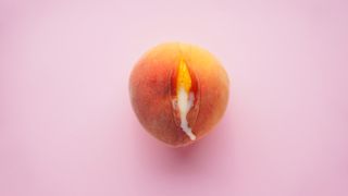 peach with white milk on pink background